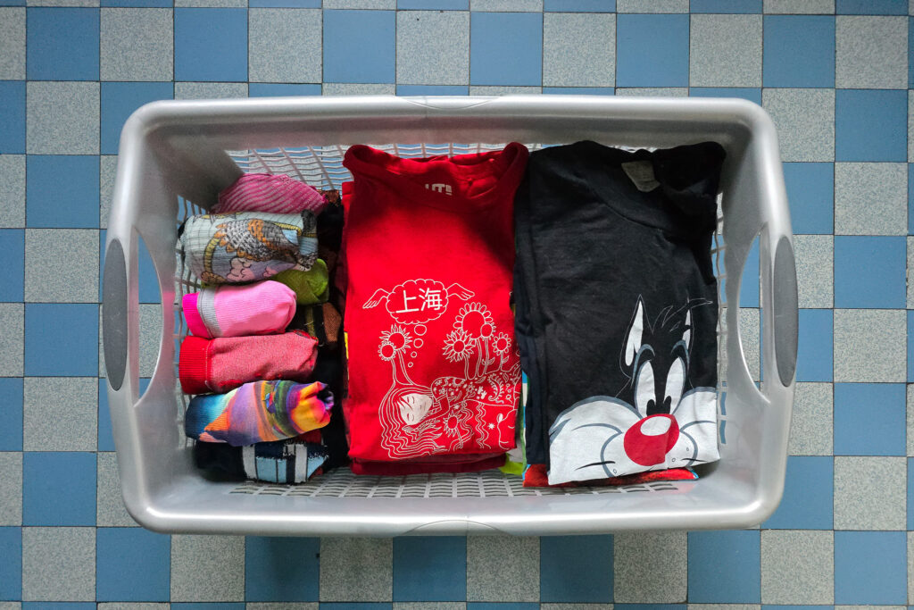 A classic autistic-style routine: clothes sorted, folded, perfectly ordered — my need for structure satisfied.